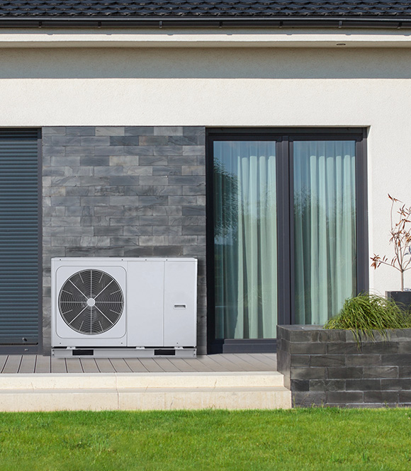 air conditioning unit installed outside a modern house features sleek design maintenance friendly landscape with green grass