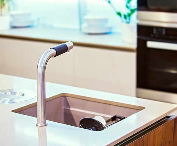 modern kitchen sink faucet with a sleek design featuring stainless steel and a black grip in a minimalist style perfect for kitchen renovations and upgrades 2 functionalities